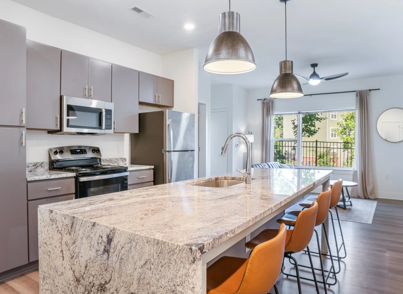 View of the kitchen with large island at 5 Row Apartments View of the kitchen with large island at 5 Row Apartments